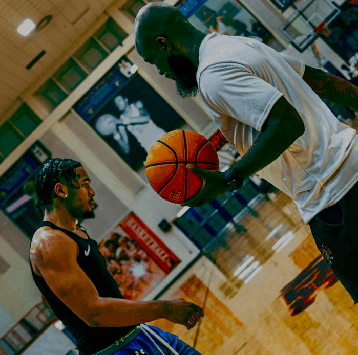 Coach Rodney working with athlete during one-on-one training session